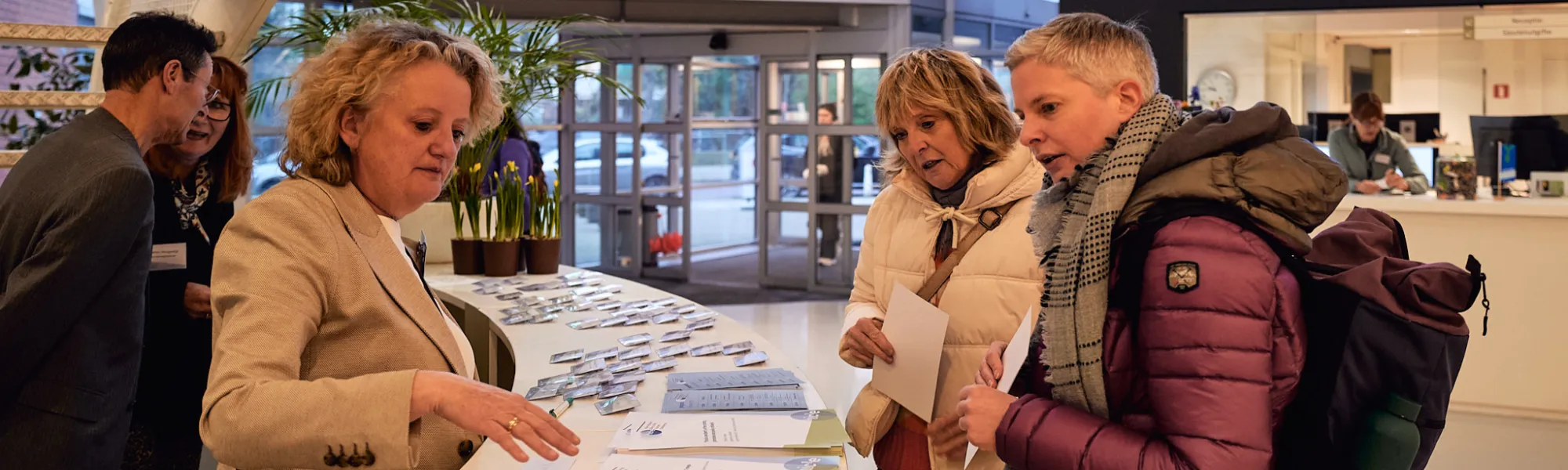 Visitors looking for the program IBTC at the counter. 